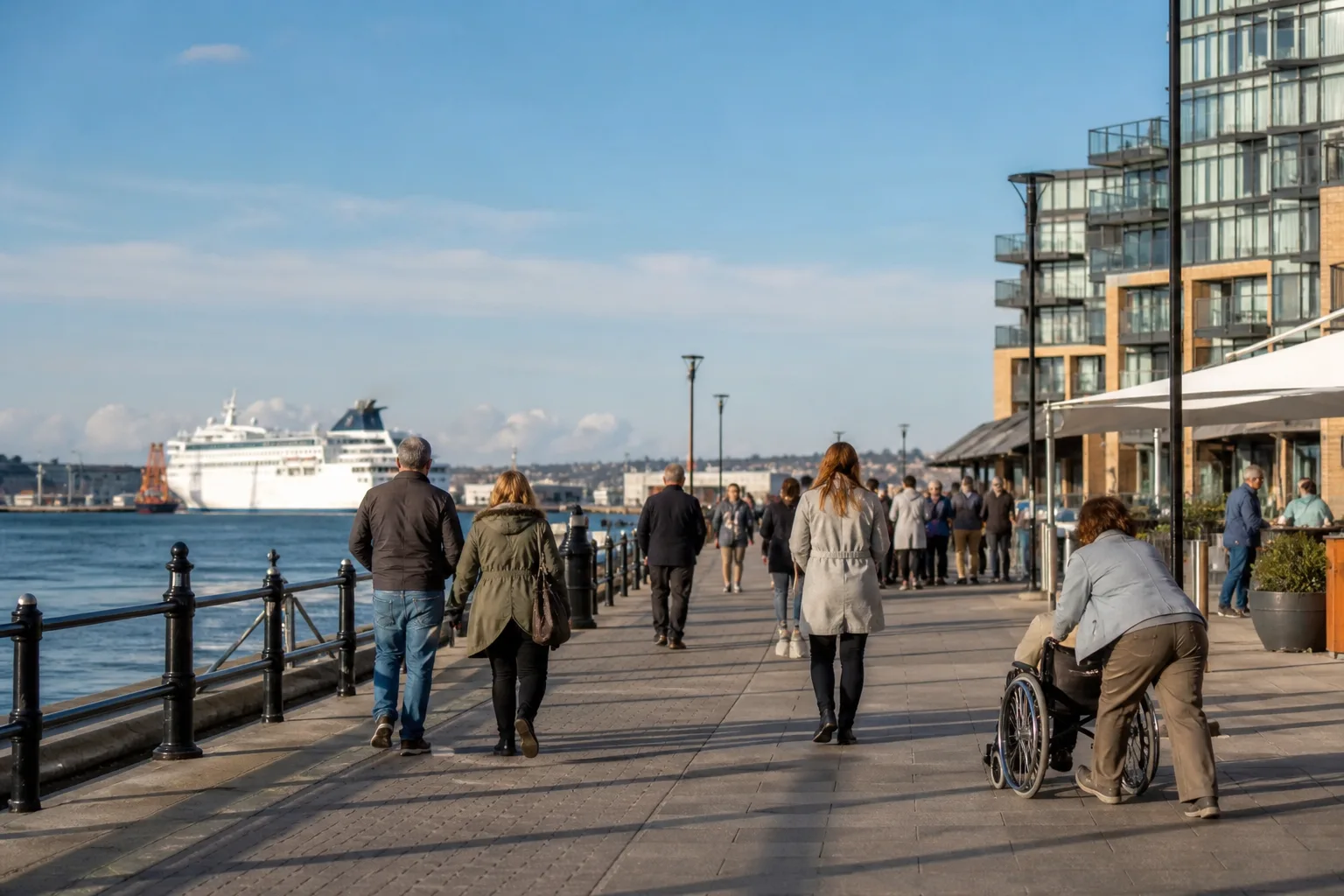 Two people talking beside the waterfront in Southampton